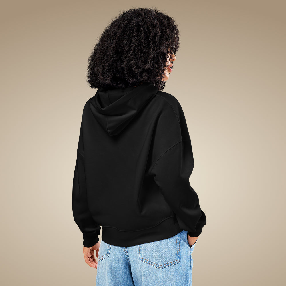 Black women’s organic cotton hoodie showing relaxed everyday fit on model