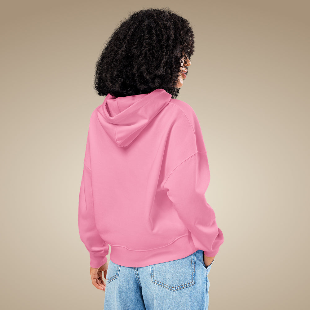 Bubble pink women’s organic cotton hoodie showing relaxed everyday fit on model