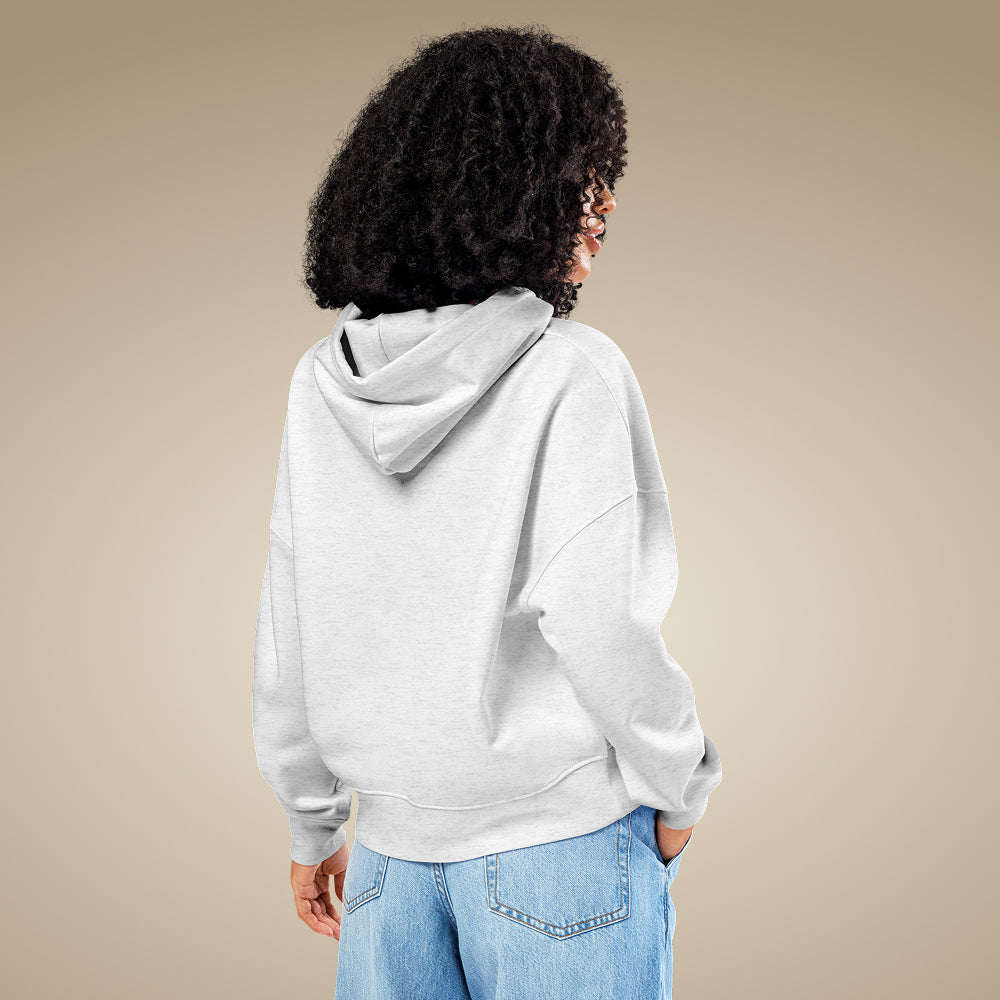 Cool heather grey women’s organic cotton hoodie showing relaxed everyday fit on model