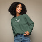 Women's organic sweatshirt made from 100% organic cotton in khaki green worn on a female model against a beige background.