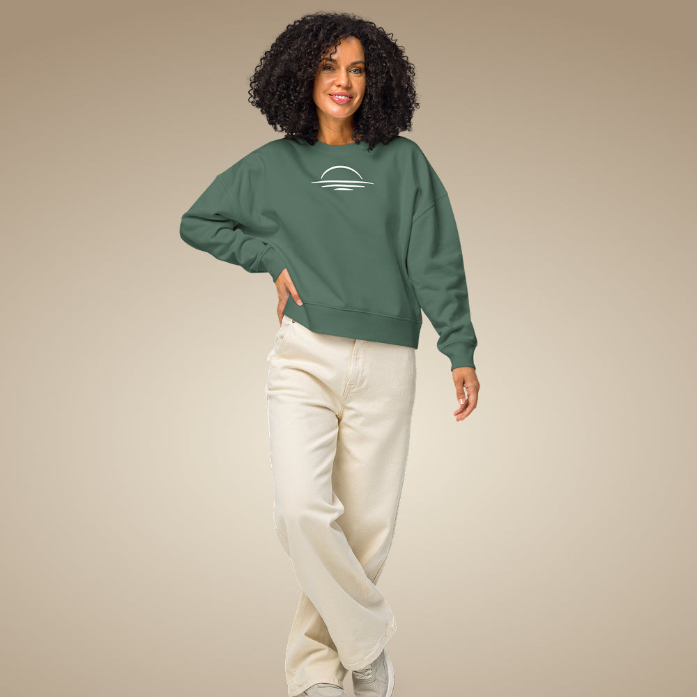 Khaki green women’s organic cotton sweatshirt showing relaxed everyday fit on model
