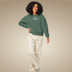 Khaki green women’s organic cotton sweatshirt showing relaxed everyday fit on model