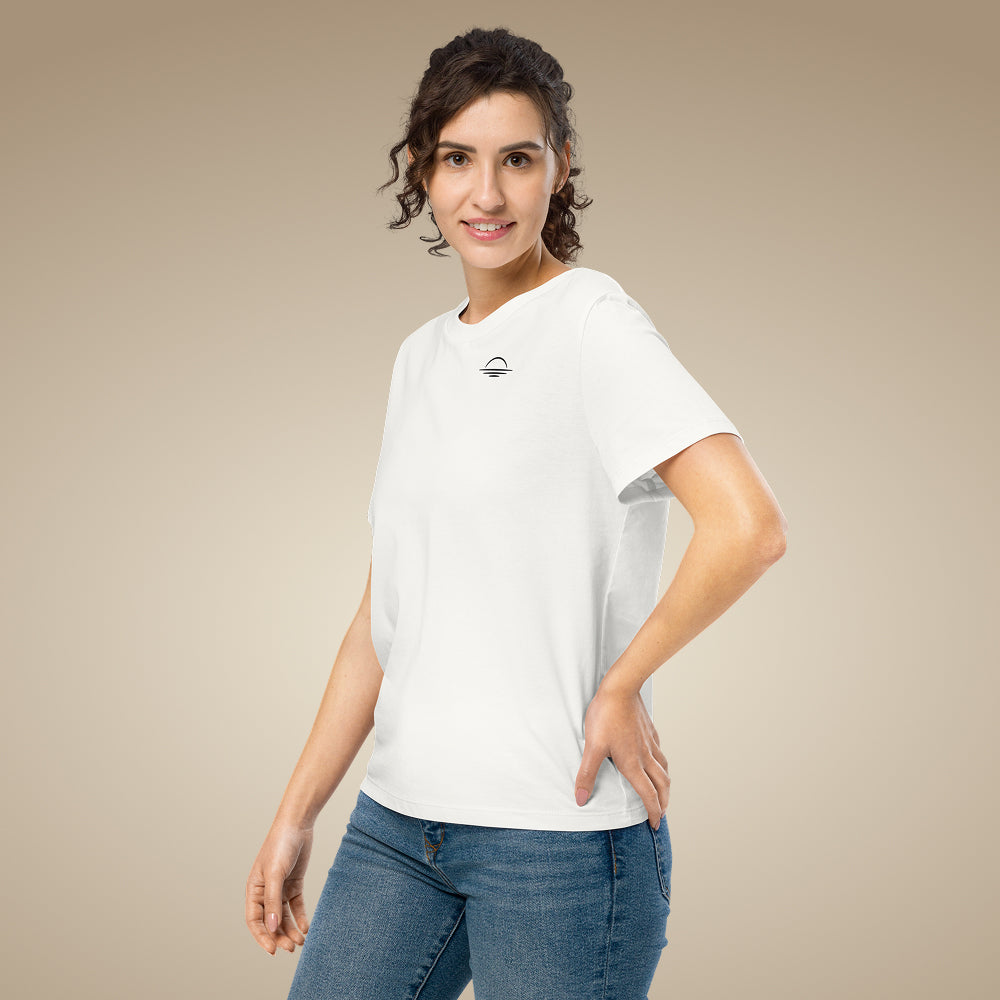 Women’s organic cotton t-shirt in off white with minimal chest logo, worn by model