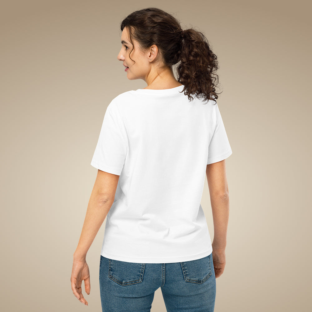 Woman wearing a white t-shirt and blue jeans on a beige background